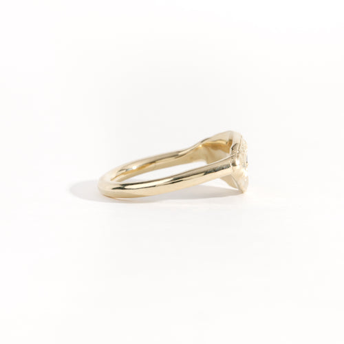 Gold ring featuring wing detailing and blue sapphire. Handmade and bespoke finish.