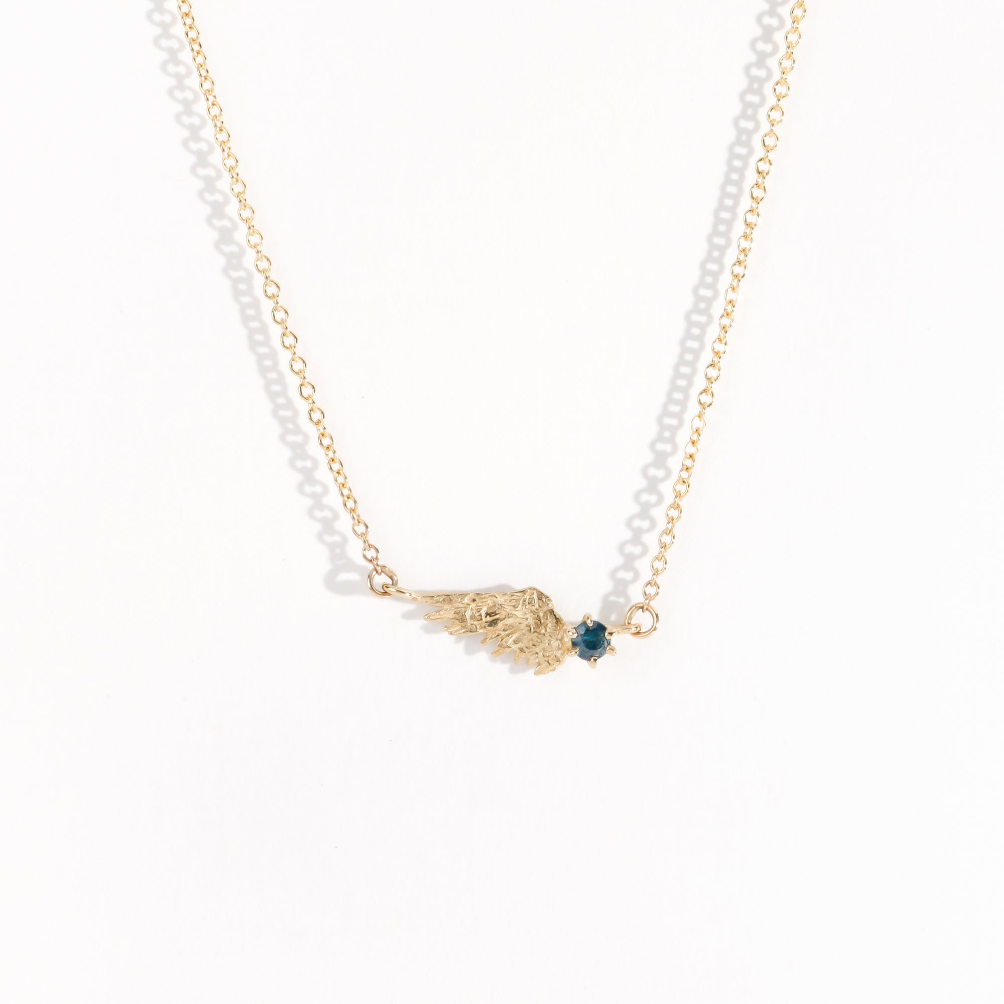 Handmade in Melbourne 9ct Yellow Gold Wing Necklace with an Ethically Sourced Australian Blue Sapphire and a 9ct Yellow Gold Chain.