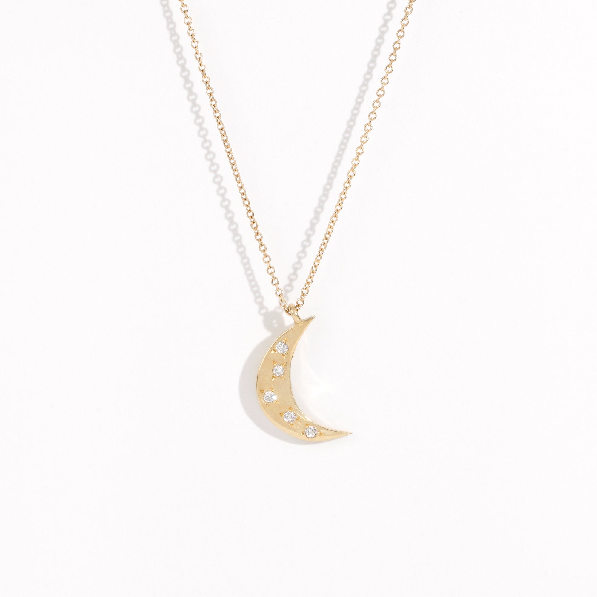 Made in Melbourne crescent moon pendant in 9ct yellow gold with diamonds star set. 