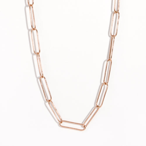 Detailed image shot of clasp of rose gold paperclip chain by Black Finch Jewellery. Long thin rose gold links connected on as a chain.
