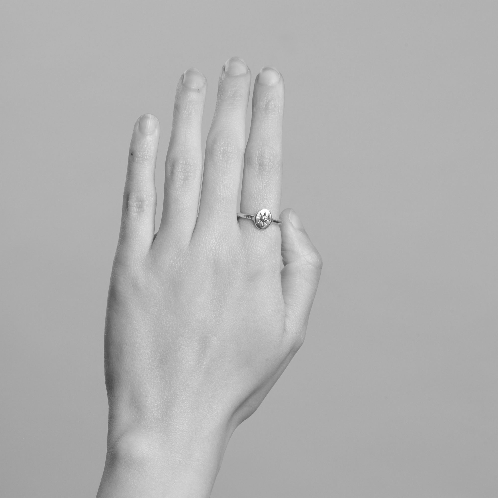 9ct yellow gold signet ring with star set pink sapphire in centre. Bespoke and handmade in Melbourne by Black Finch Jewellery