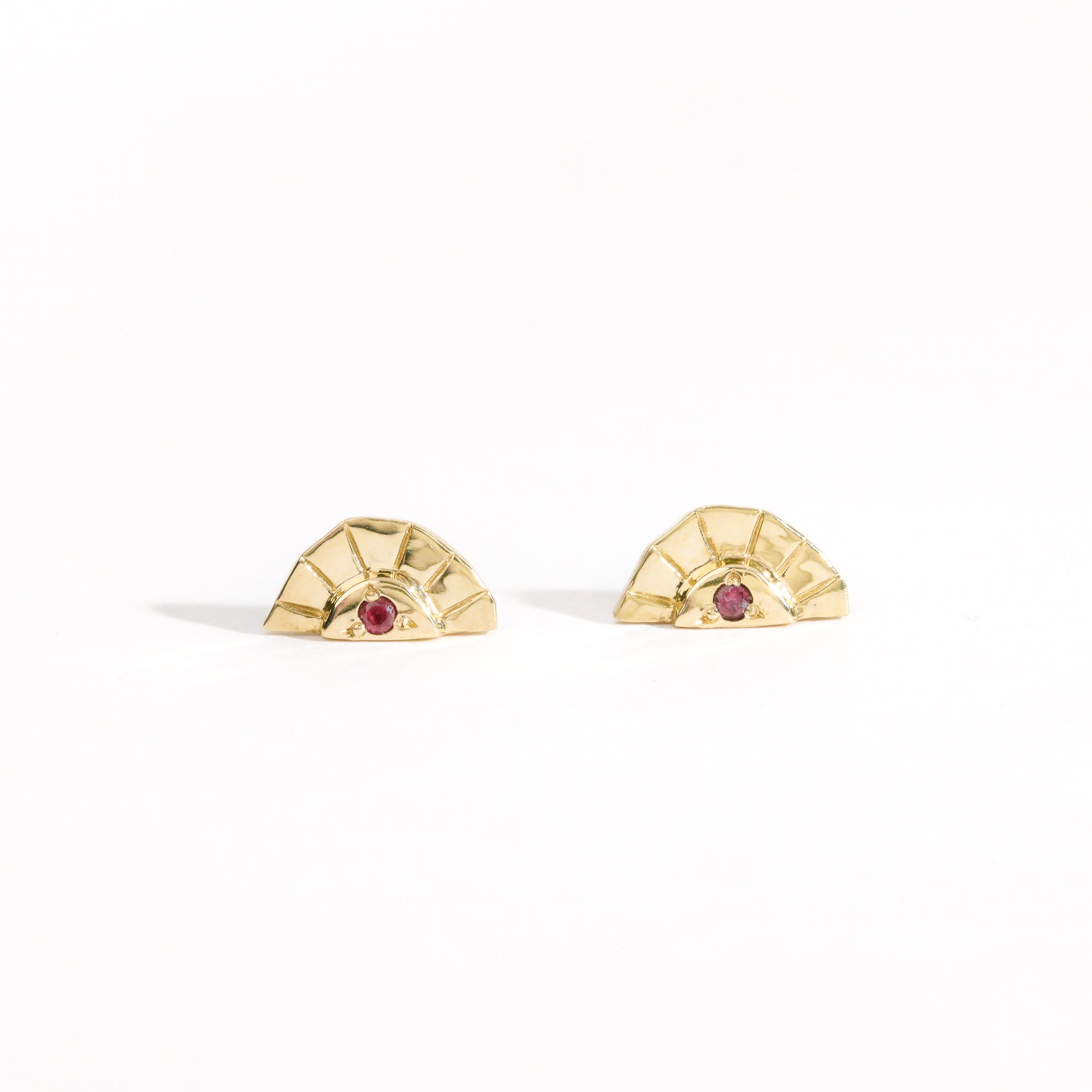 Rising sun earrings with centre red sapphire crafted in 9ct yellow gold by Black Finch Jewellery