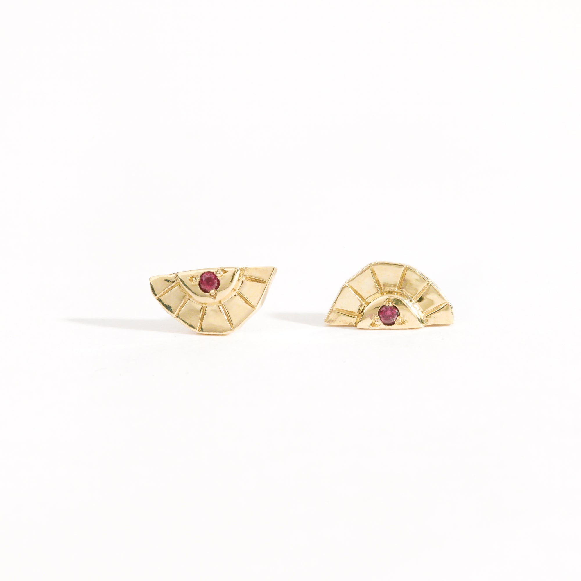 Rising sun earrings with centre red sapphire crafted in 9ct yellow gold by Black Finch Jewellery