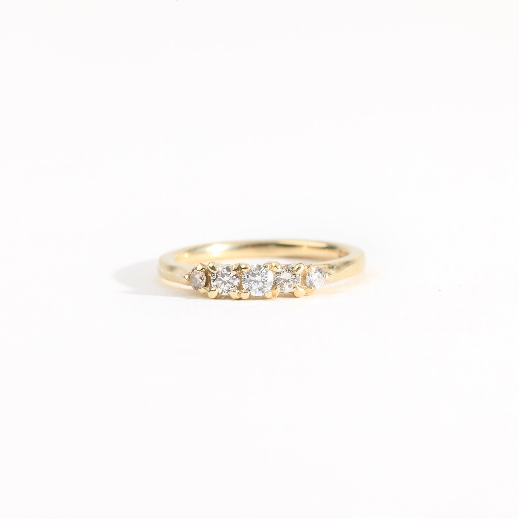 Hand crafted yellow gold five stone champagne diamond ring. 