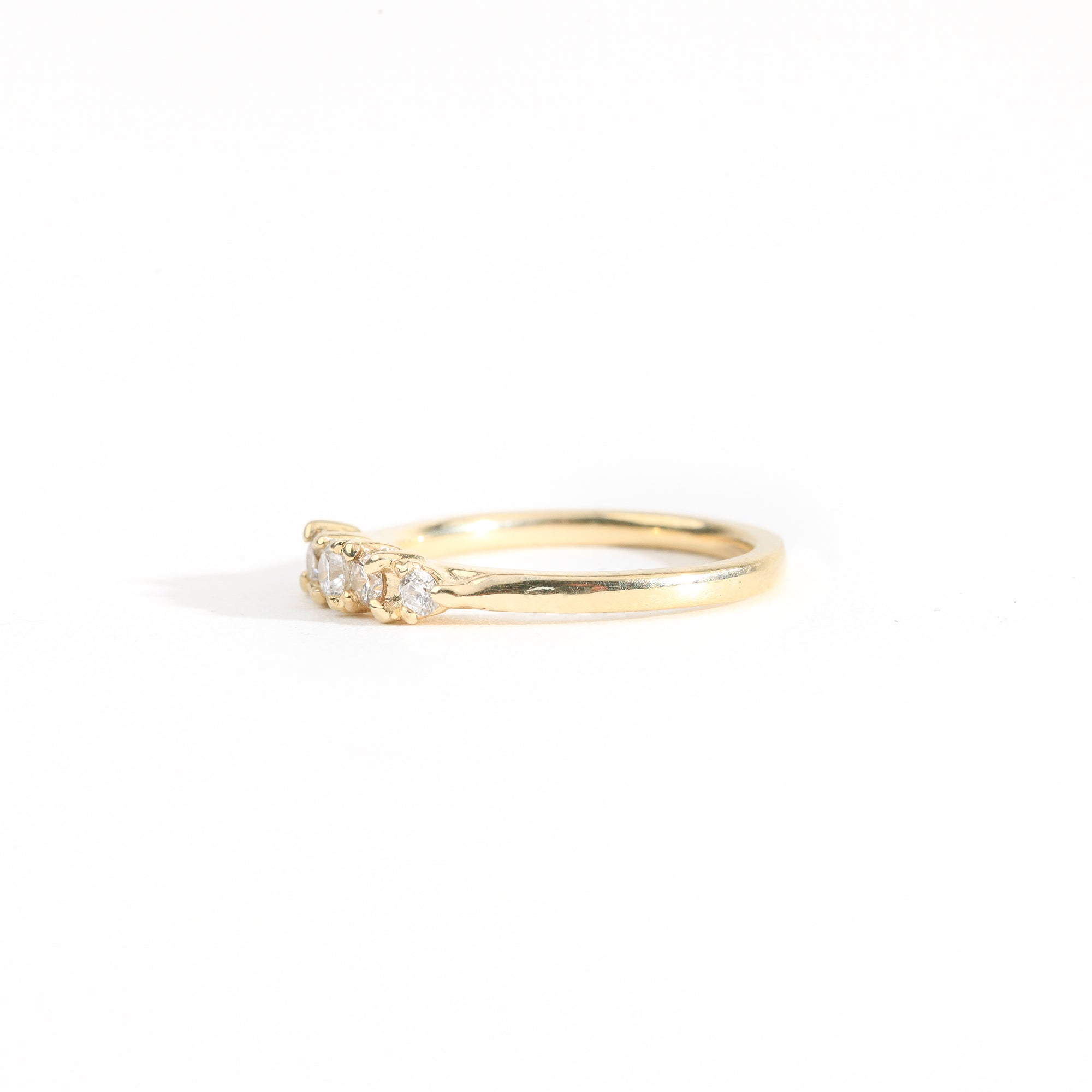 Hand crafted yellow gold five stone champagne diamond ring. 