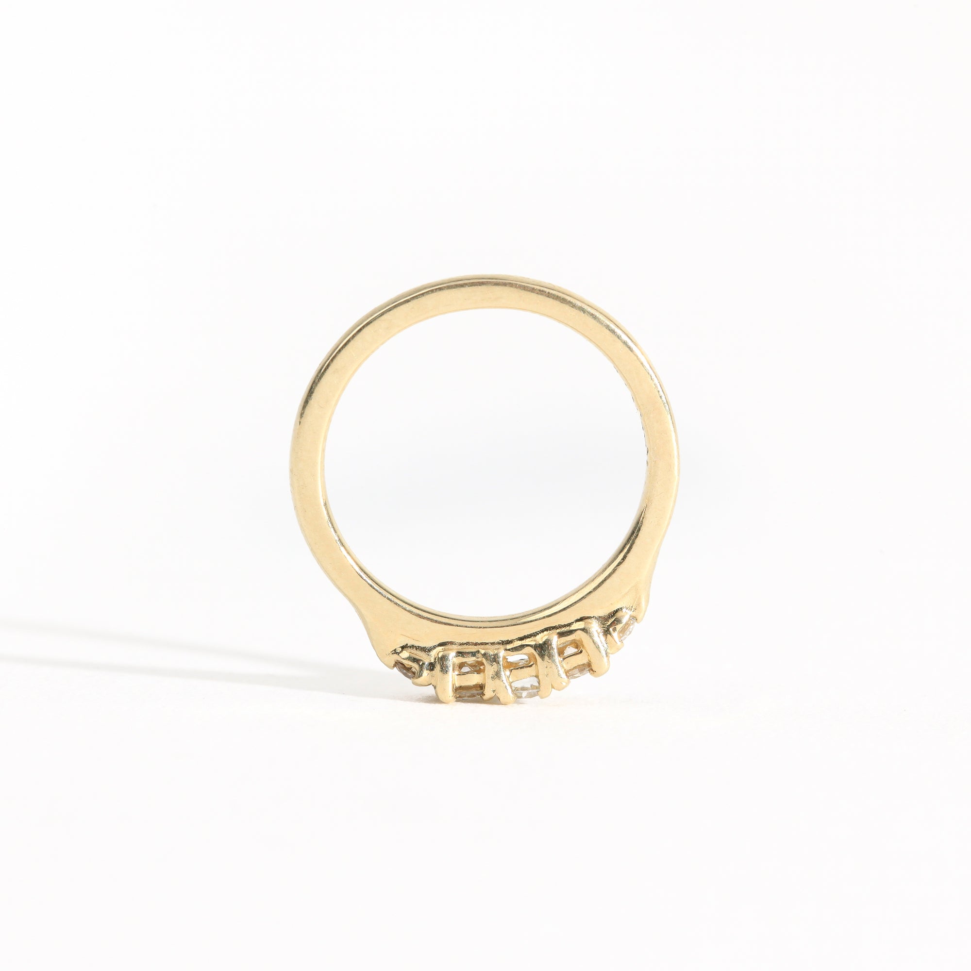 Hand crafted yellow gold five stone champagne diamond ring. 