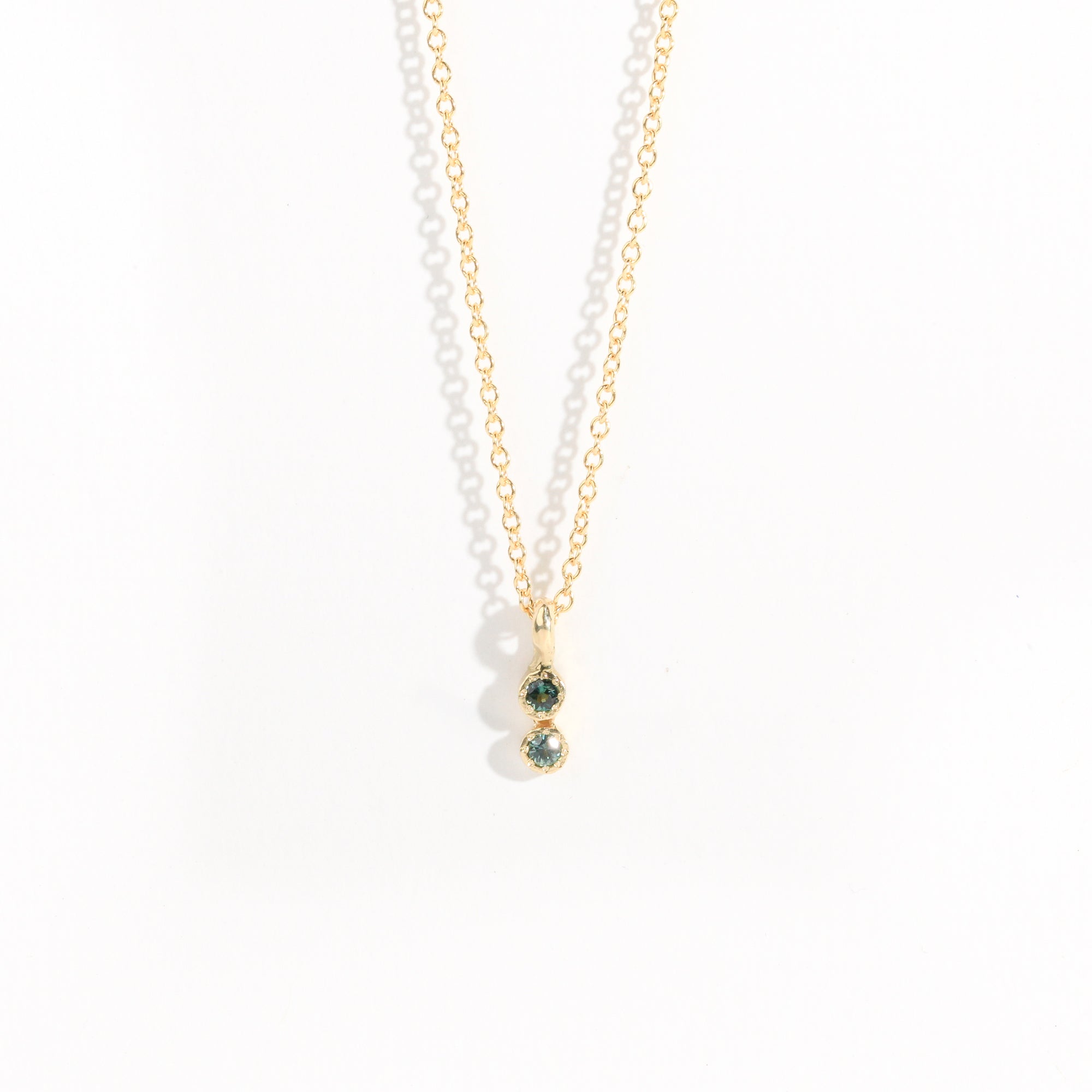 Petite two stone pendant with ethically sourced Australian sapphires crafted in yellow gold by Black Finch