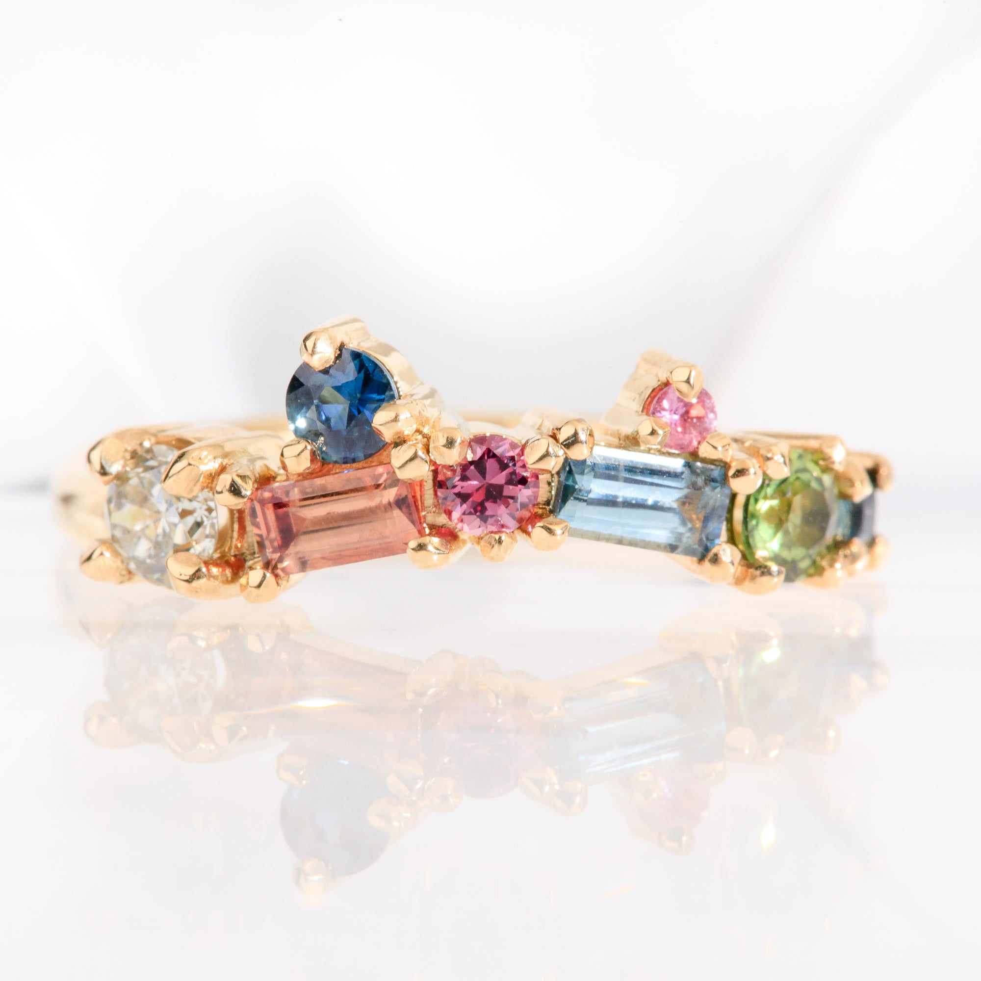 Colourful, ethically sourced Australian sapphires and diamond wedding band in 18ct yellow gold. Handcrafted in Melbourne.Colourful ethically sourced Australian sapphires and diamond wedding band in 18ct yellow gold. Handcrafted in Melbourne.