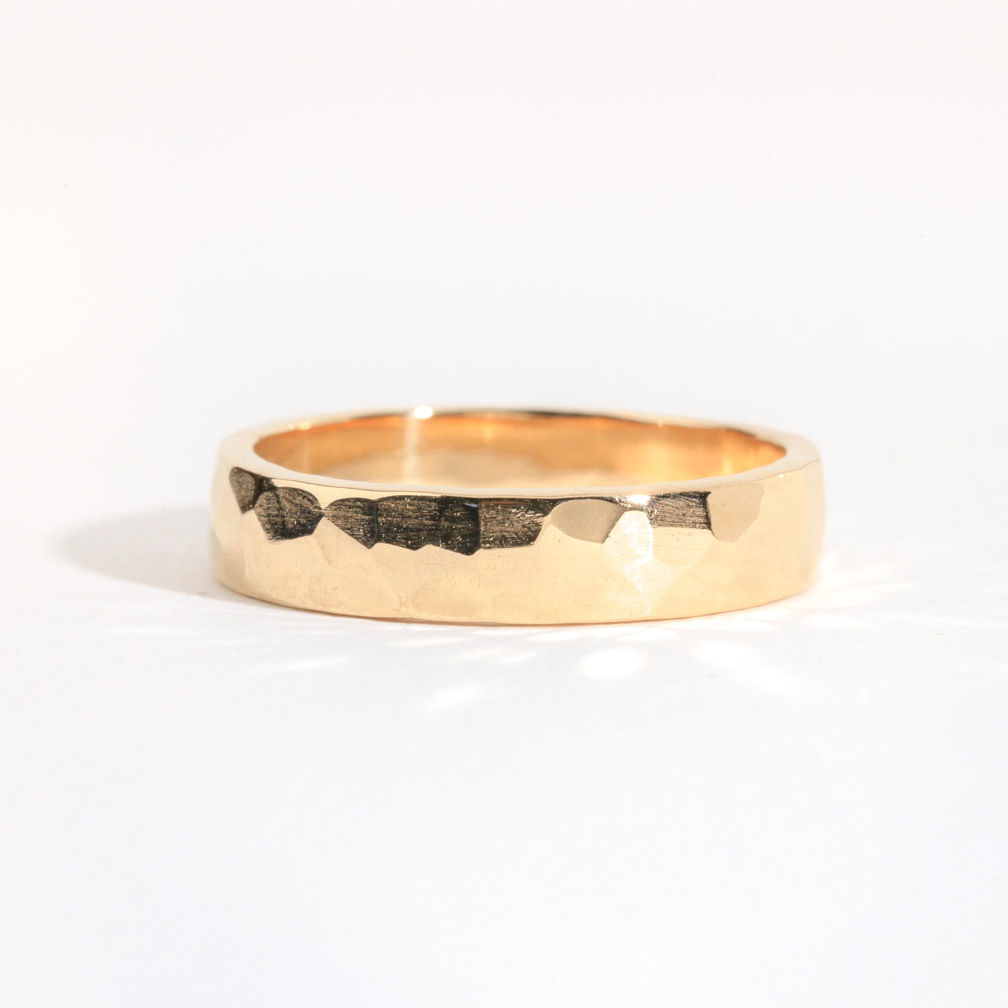 Men's wedding band in 18ct yellow gold with a soft chiseled finish, Custom bespoke handmade jewellery.