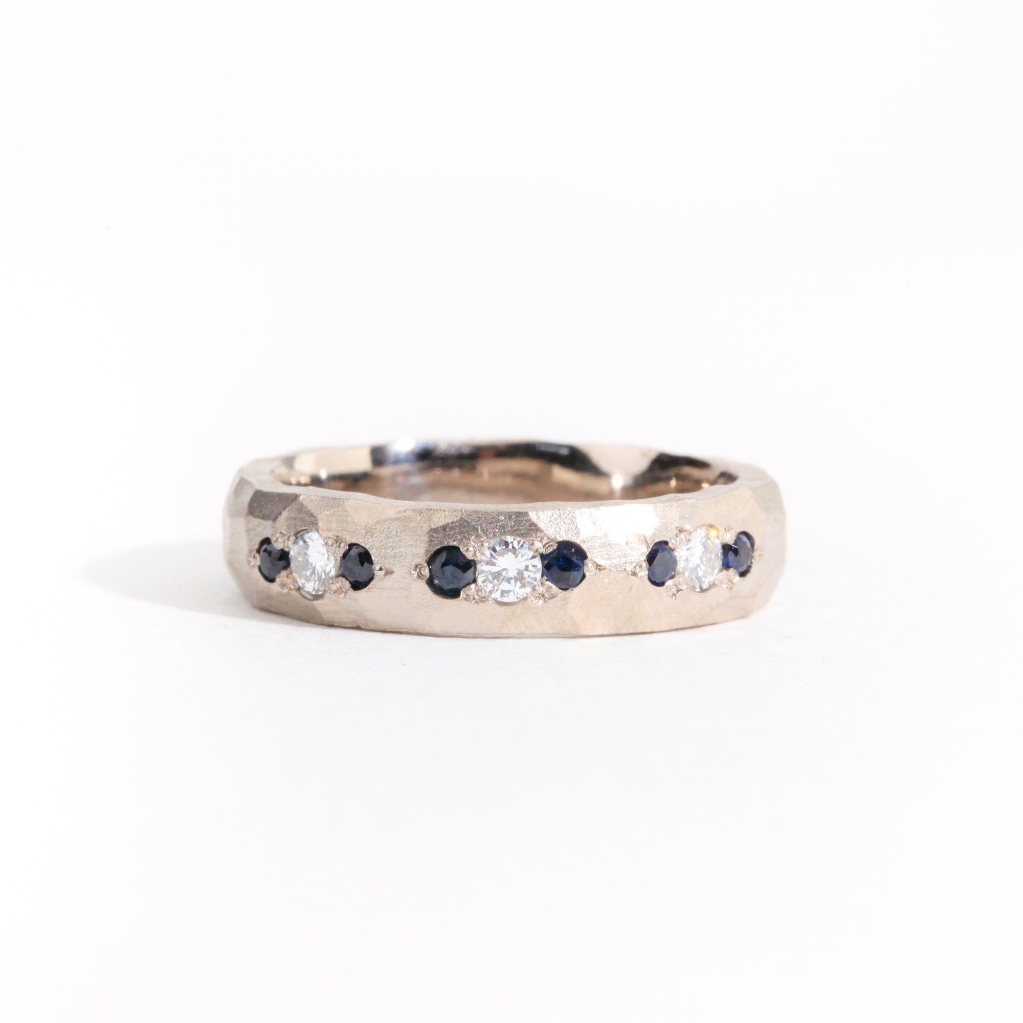 Hammered 18 carat white gold men's wedding band, set with ethically sourced Australian sapphires and conflict free diamonds. 