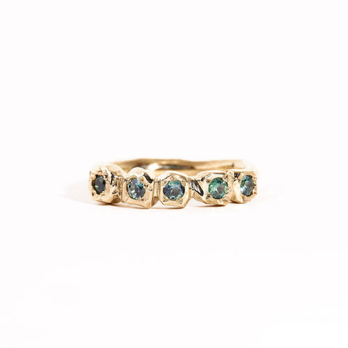 9 carat yellow gold handcrafted ring, featuring a row of five ethically sourced Australian teal sapphires. 