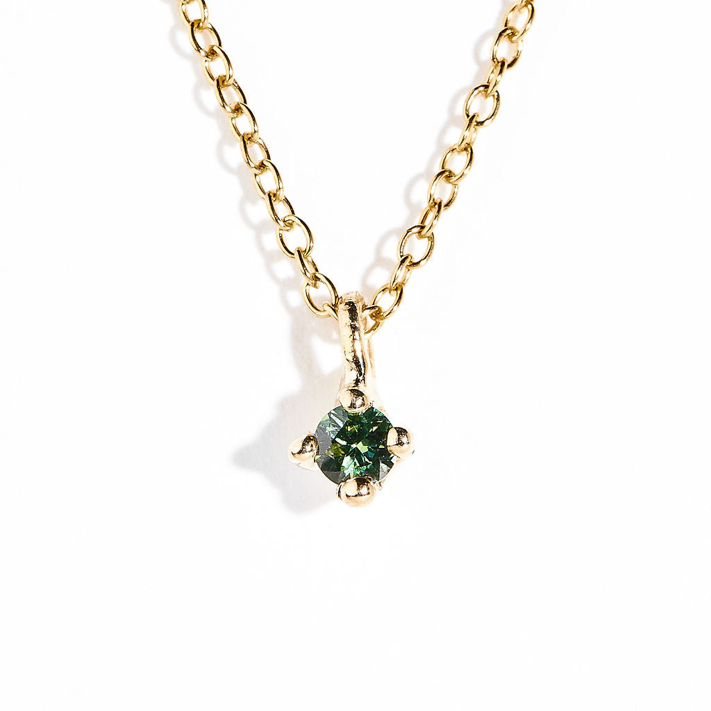 Single stone seafoam green Australian sapphire in claw setting 9ct yellow on chain. Hand made by Black Finch in Melbourne