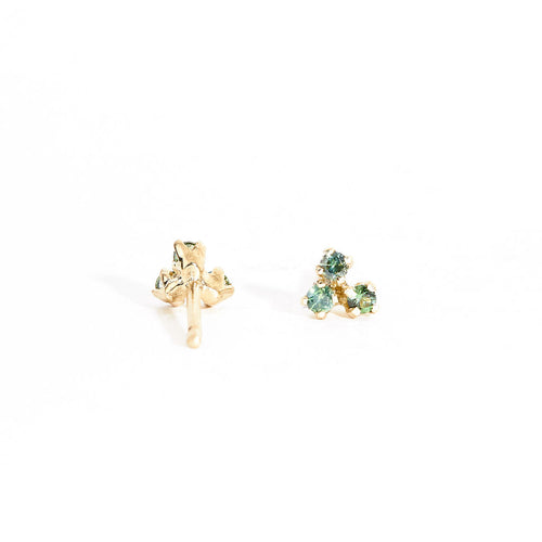 A pair of gold stud earrings featuring a mixture of blue, green ethically sourced Australian sapphires. Handmade in Melbourne by Black Finch Jewellery.