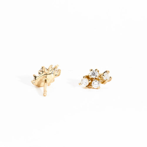 Pair of gold studs featuring four mixed white diamonds. Bespoke and handmade in Melbourne by Black Finch Jewellery.