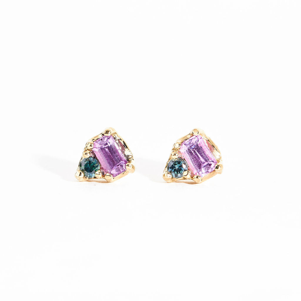 Two stone earrings with emerald cut pink sapphires and ethically sourced blue Australian sapphires crafted in 9ct yellow gold by Black Finch Jewelley