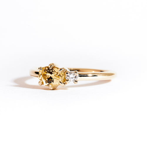 Two stone ring crafted in 9ct yellow gold with yellow sapphire and white diamond. By black finch