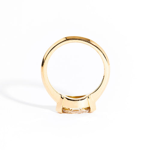 Hand crafted 18 carat yellow gold solitaire ring with marquise champagne diamond.