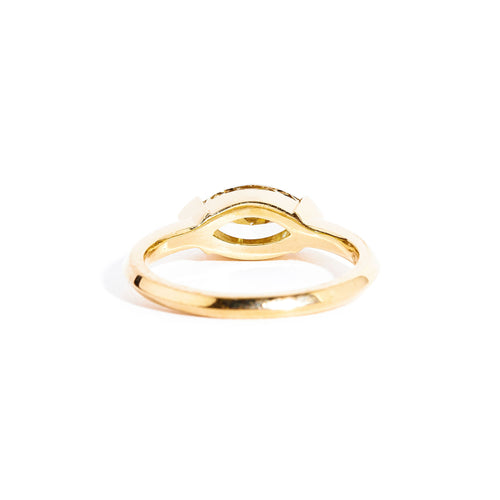 Hand crafted 18 carat yellow gold solitaire ring with marquise champagne diamond.