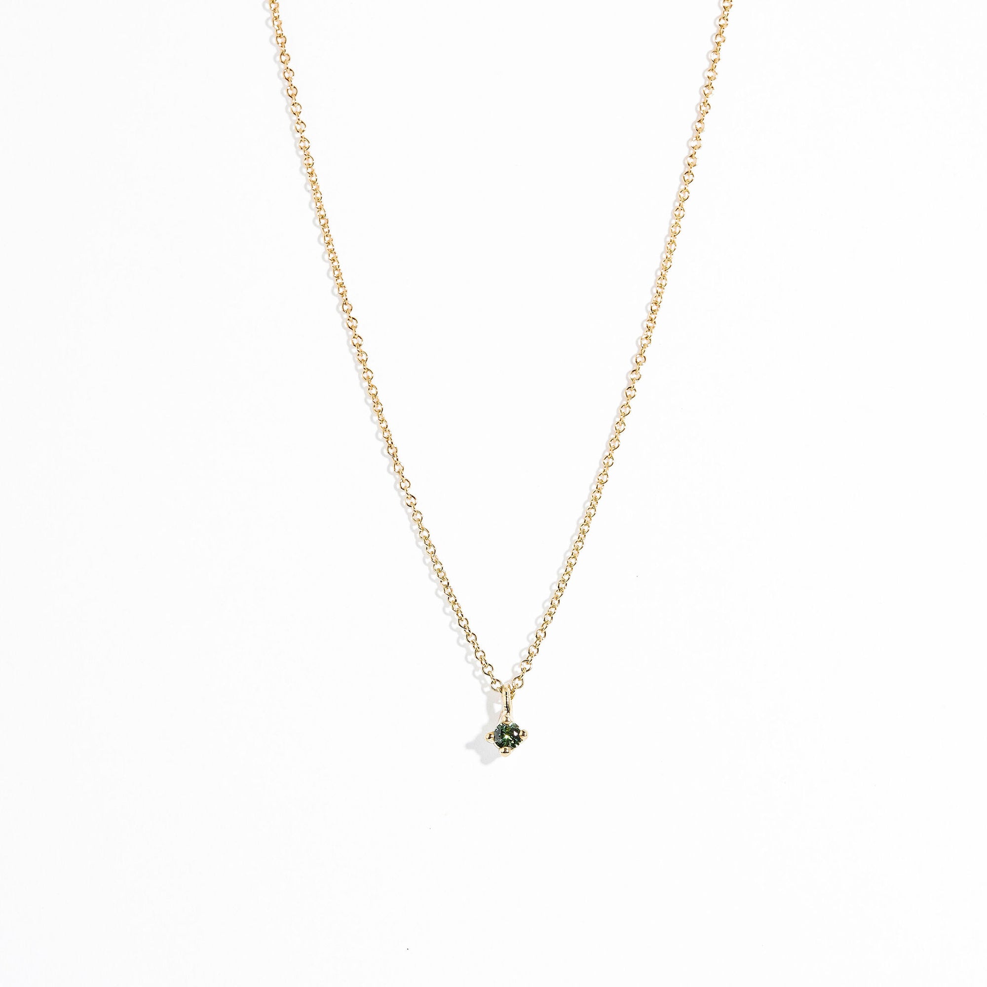 Single stone seafoam green Australian sapphire in claw setting 9ct yellow on chain. Hand made by Black Finch in Melbourne