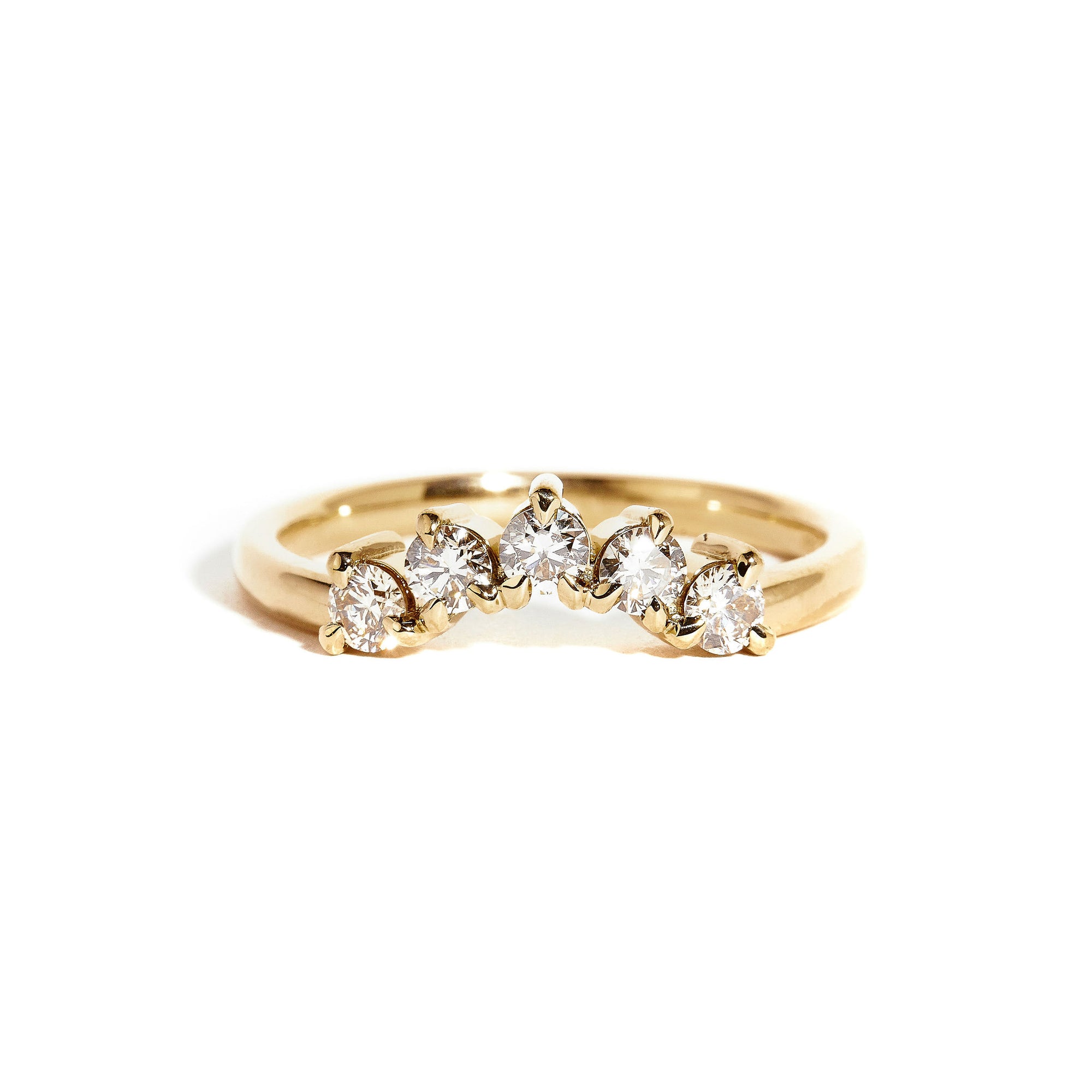 18 carat yellow gold woman's wedding band with 5 round champagne diamonds, claw set in a slight curve.