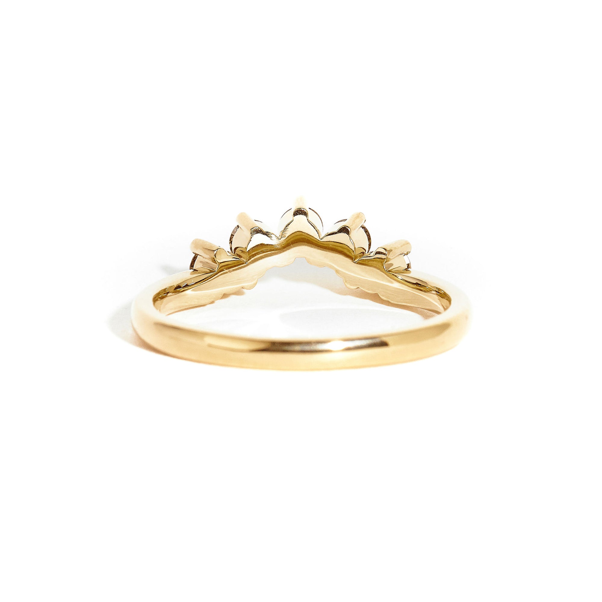 18 carat yellow gold woman's wedding band with 5 round champagne diamonds, claw set in a slight curve.