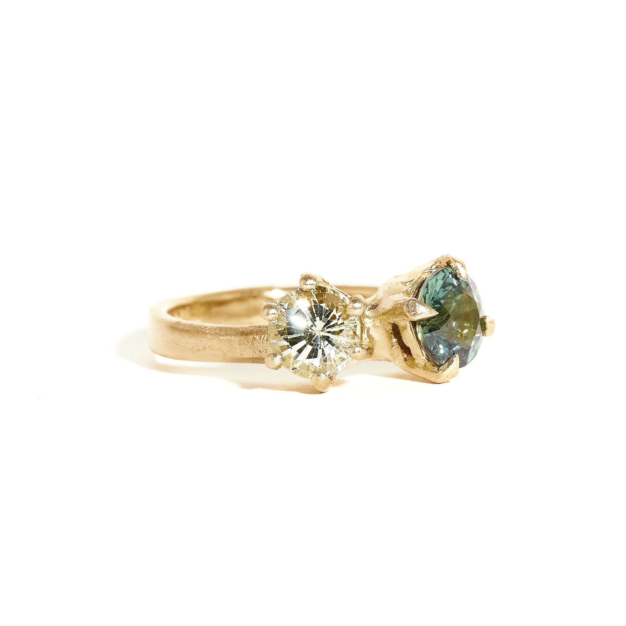 Two stone sapphire ring with light green and teal sapphires in 9ct yellow gold