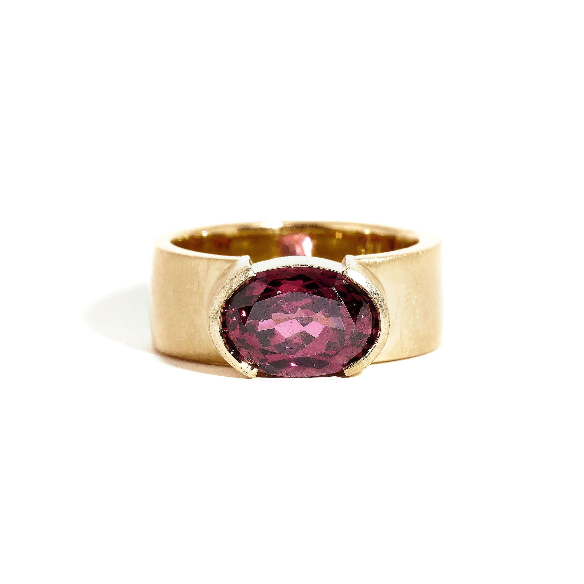 Garnet ring wth 7mm band and partial bezel setting