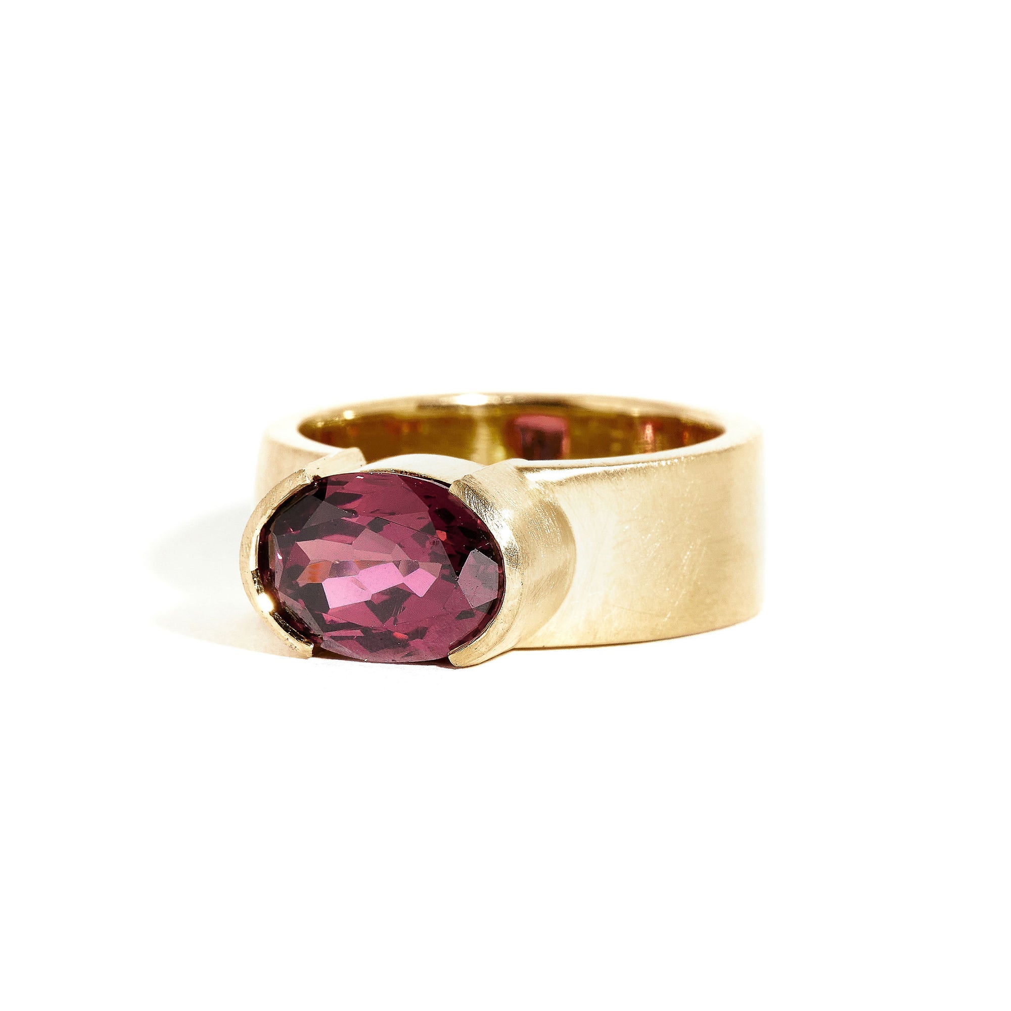 Garnet ring wth 7mm band and partial bezel setting