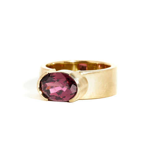 Garnet ring wth 7mm band and partial bezel setting