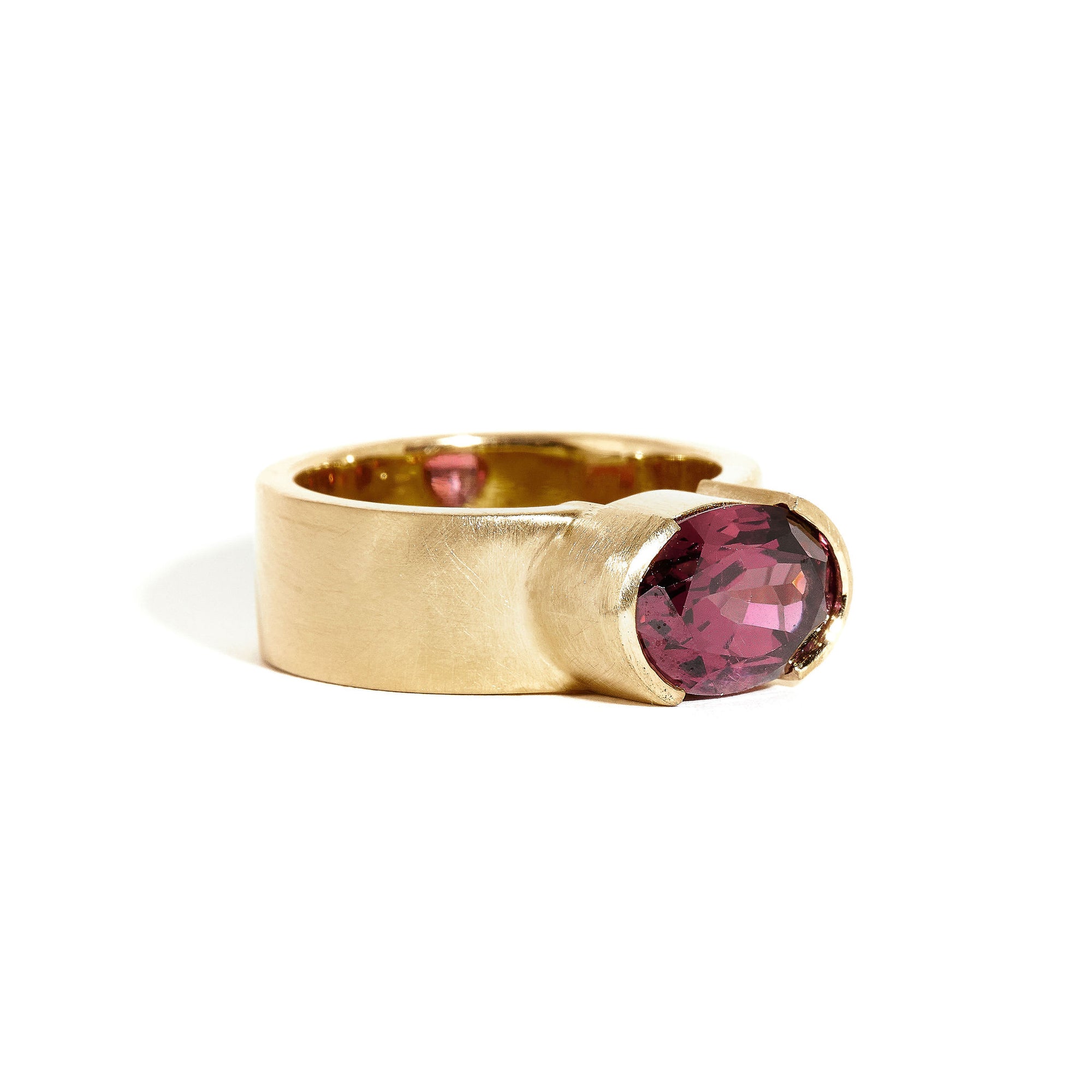 Garnet ring wth 7mm band and partial bezel setting