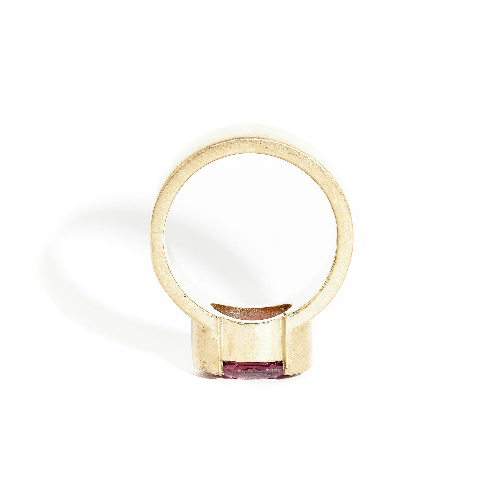 Garnet ring wth 7mm band and partial bezel setting