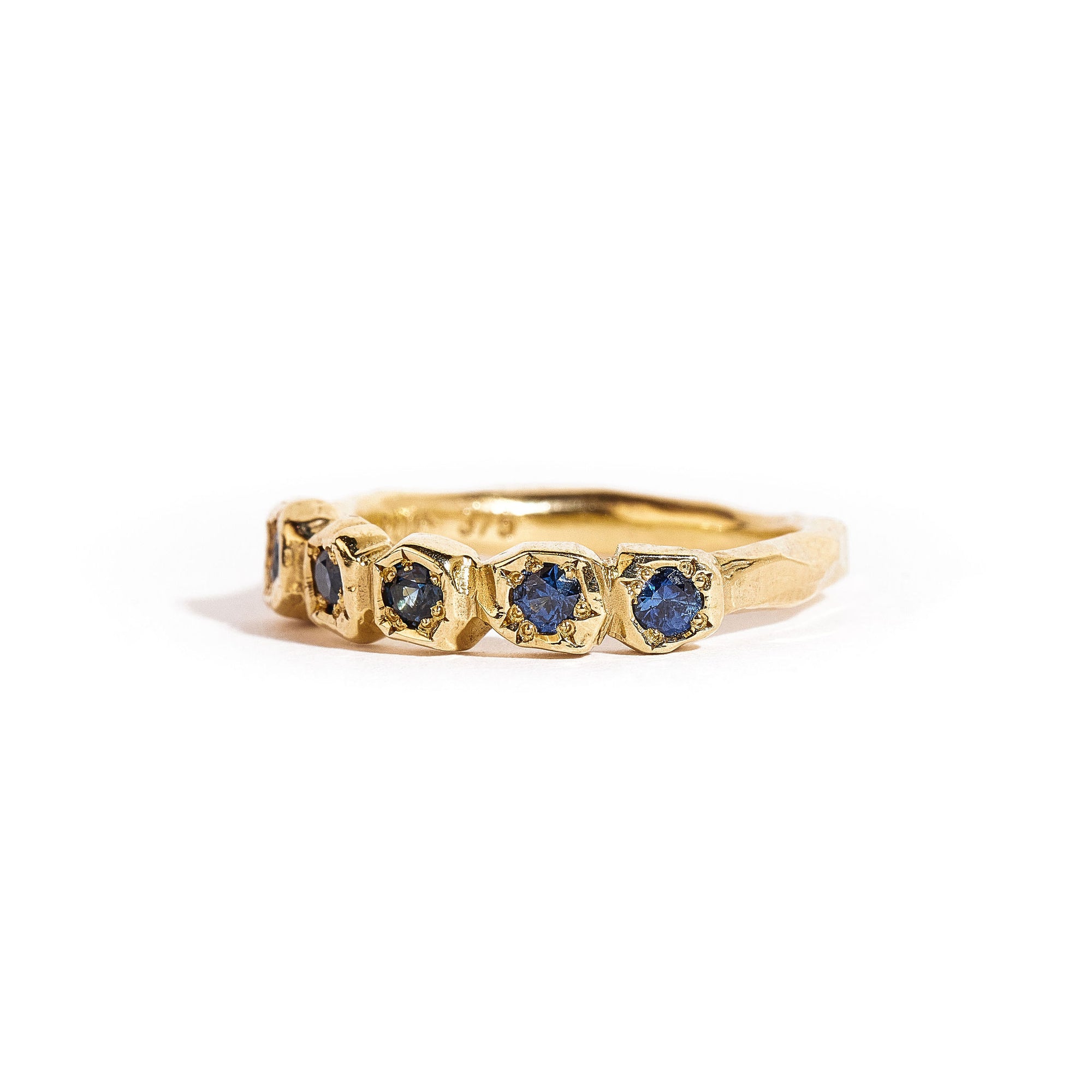 9 carat yellow gold handcrafted ring, featuring a row of five ethically sourced Australian blue sapphires. 