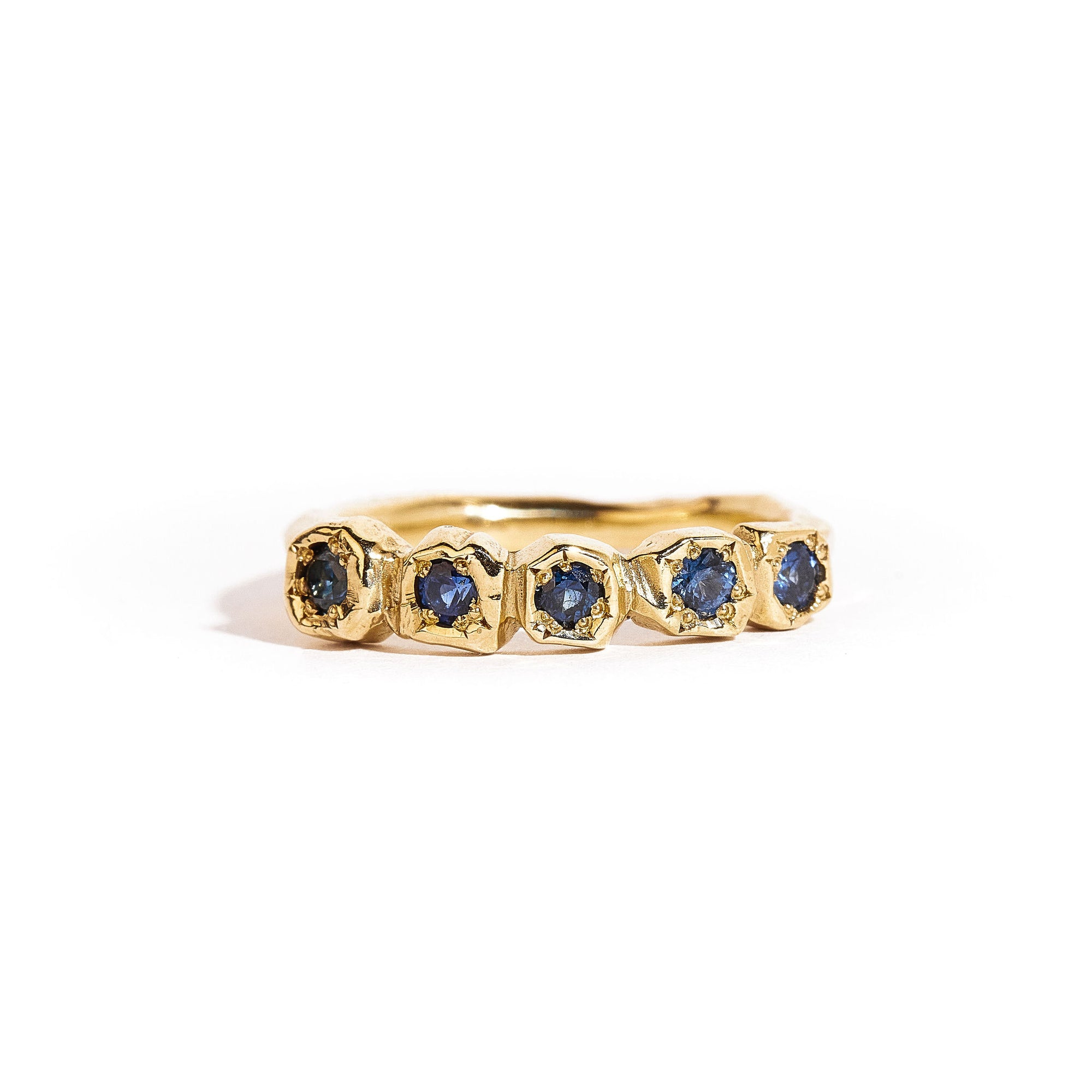 9 carat yellow gold handcrafted ring, featuring a row of five ethically sourced Australian blue sapphires. 