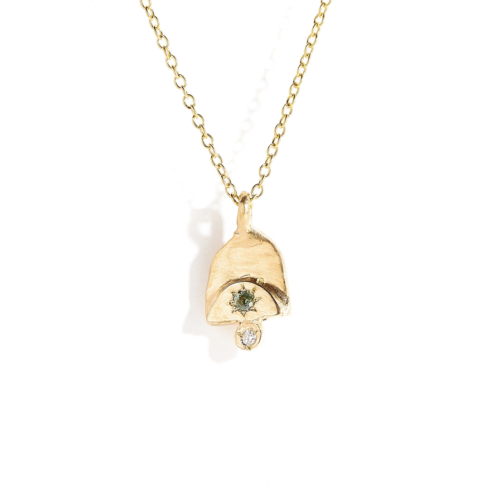 Teal sapphire and white diamond pendant in 9 carat yellow gold. 