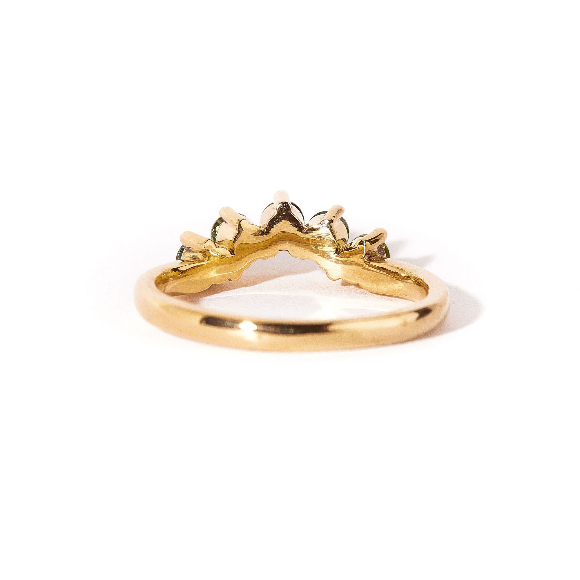 18 carat yellow gold woman's wedding band with 5 round, ethically sourced Australian blue/green parti sapphires, claw set in a slight curve.