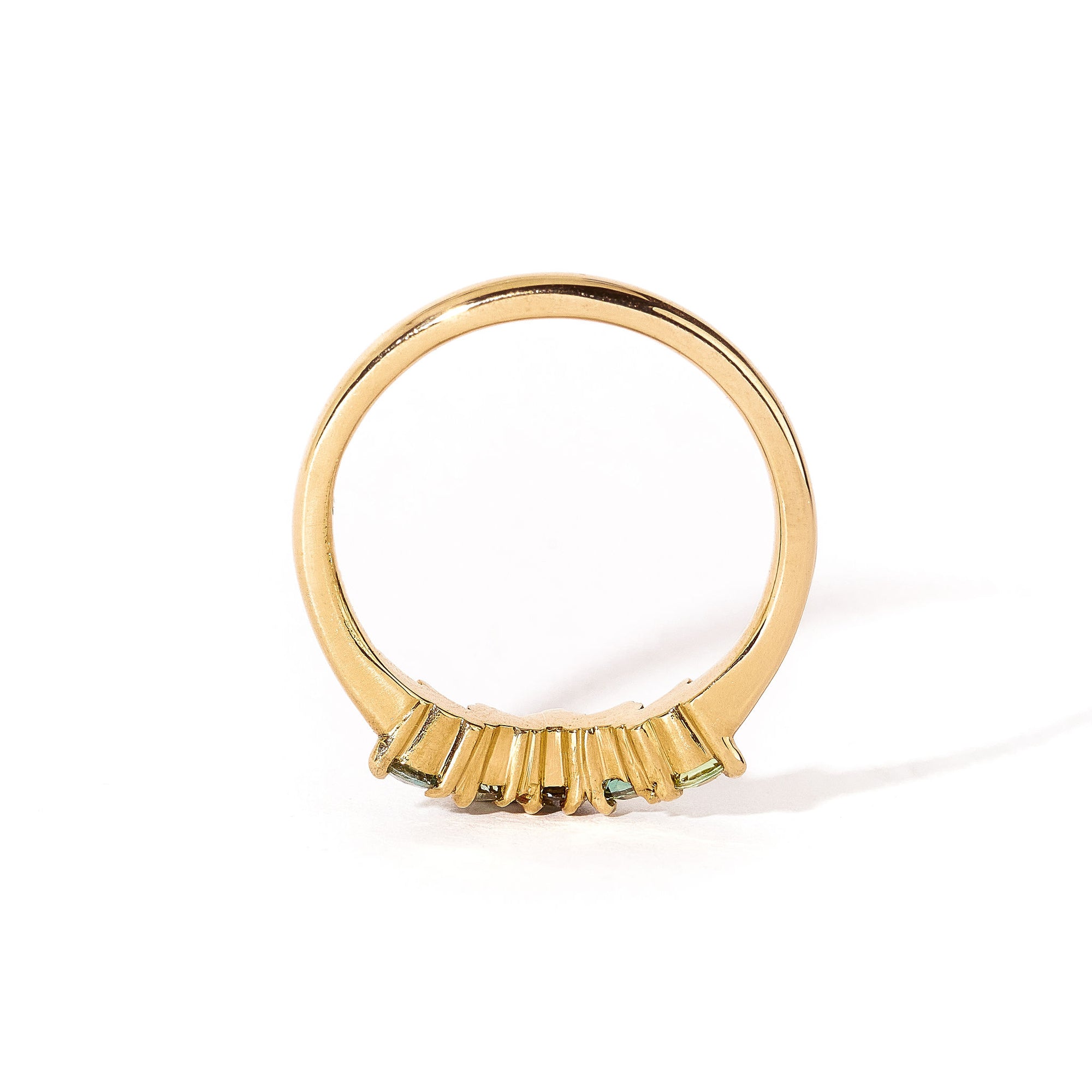 18 carat yellow gold woman's wedding band with 5 round, ethically sourced Australian blue/green parti sapphires, claw set in a slight curve.