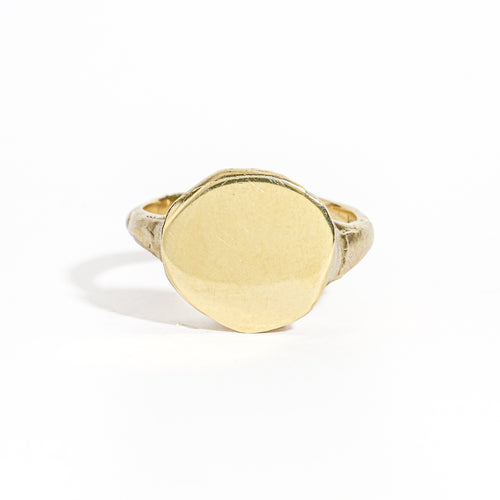 9 carat yellow gold round signet ring with a polished surface and soft matte band.