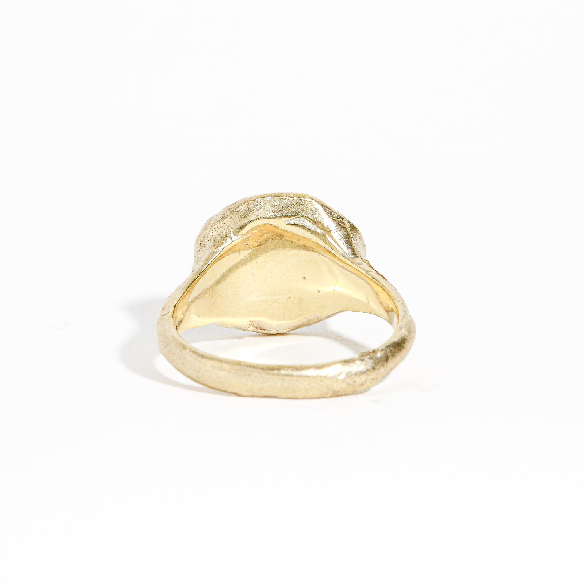 9 carat yellow gold round signet ring with a polished surface and soft matte band.