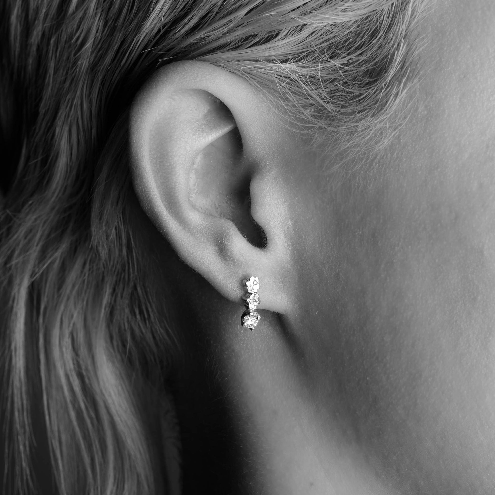 Diamond Flower Shaped Earrings in 9 Carat Yellow worn on the ear