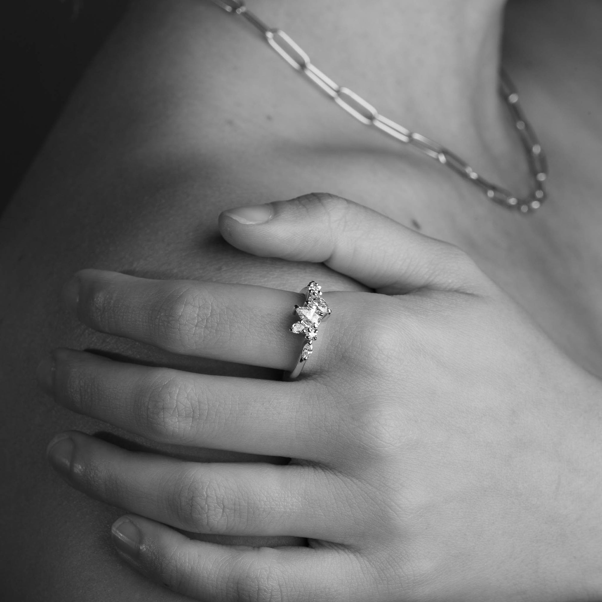 Seven Stone Diamond Ring with Two Pear Cut Diamonds in 18 Carat Yellow Gold worn on the hand