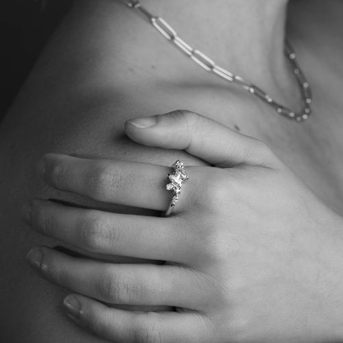 Seven Stone Diamond Ring with Two Pear Cut Diamonds in 18 Carat Yellow Gold worn on the hand