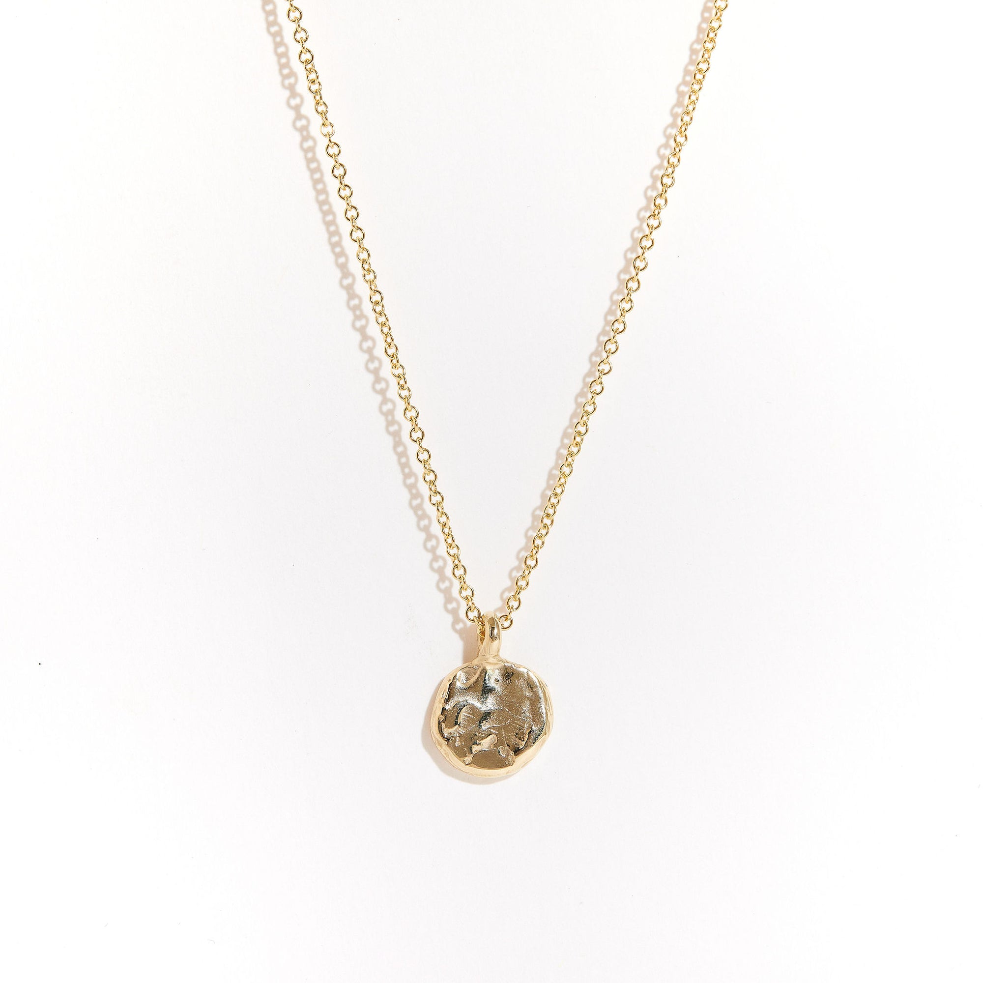 Handcrafted in Melbourne a 9ct yellow recycled, refined gold pendant with diamonds and sapphires.