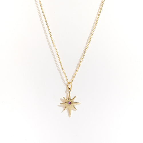 Bespoke handcrafted in Melbourne a 9ct yellow recycled, refined gold star shaped pendant with pink sapphire.