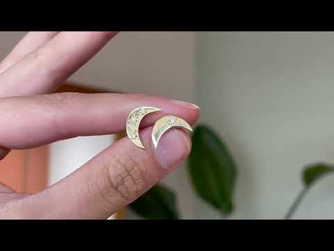 Handmade 9 carat yellow gold moon shaped studs, set with four round diamonds, gently catching the sunlight. 