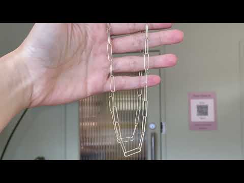 Video of gold paperclip chain by Black Finch Jewellery. Long thin gold links connected on as a chain. Bespoke, handmade and crafted in Melbourne.