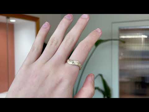 Gold ring featuring wing detailing and blue sapphire. Handmade and bespoke finish.